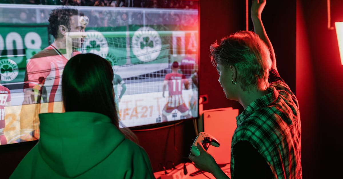 Two friends enjoying an exhilarating video game session indoors, captured with vibrant lighting.